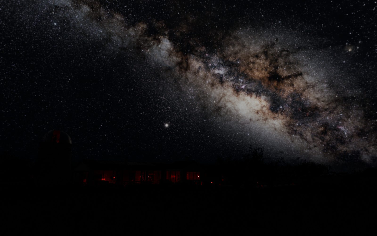 Native night render showing the windmill and house beneath an illustrative Milky Way background.